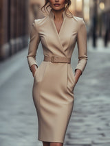 Black Lumina Wear belted sheath midi dress with mandarin collar and long sleeves, displayed on a hanger.