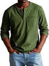 Person wearing a green long-sleeve henley shirt with a pocket and light blue jeans on a white background
