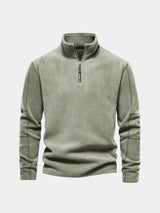 Flat lay of the sage green quarter-zip pullover
